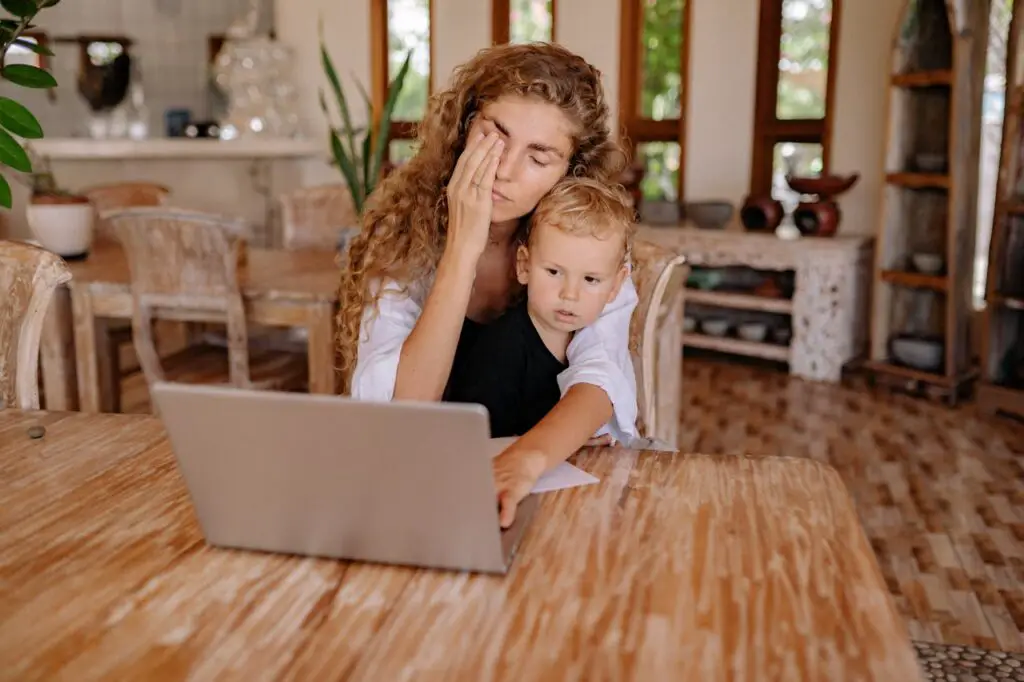  A tired mother working with her child