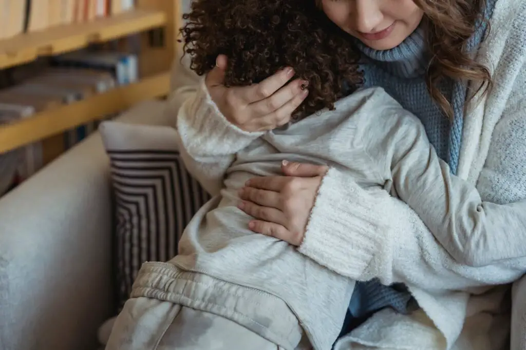 A mother soothing a sensitive child