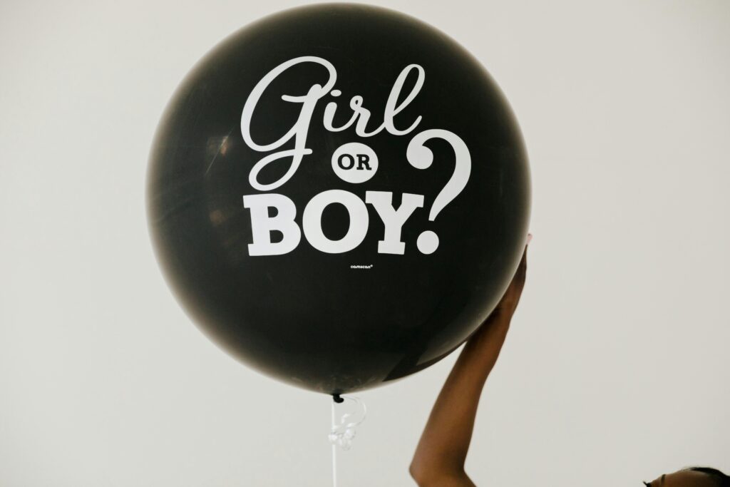 Black gender reveal balloon with 'Girl or Boy?' text, perfect for baby showers and celebrations.